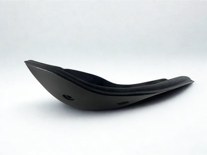 Side profile of a black BackJoy posture corrector seat, showing its active stabilizing curved design.