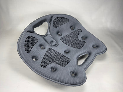 Top view of a gray BackJoy posture corrector seat with traction grips to maintain aligned, pain-free sitting.